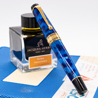 Aurora Optima Blue & Gold Rollerball Pen capped