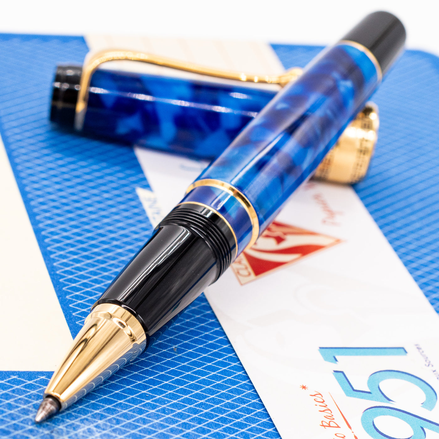 Aurora Optima Blue & Gold Rollerball Pen uncapped