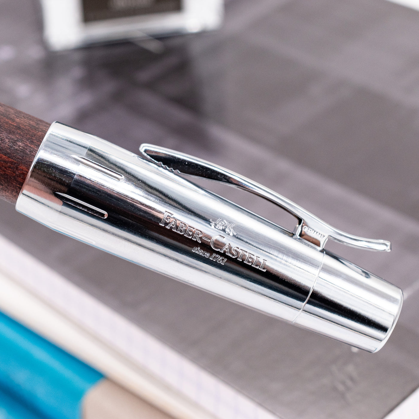 Faber-Castell E-Motion Dark Brown Wood & Chrome Fountain Pen logo