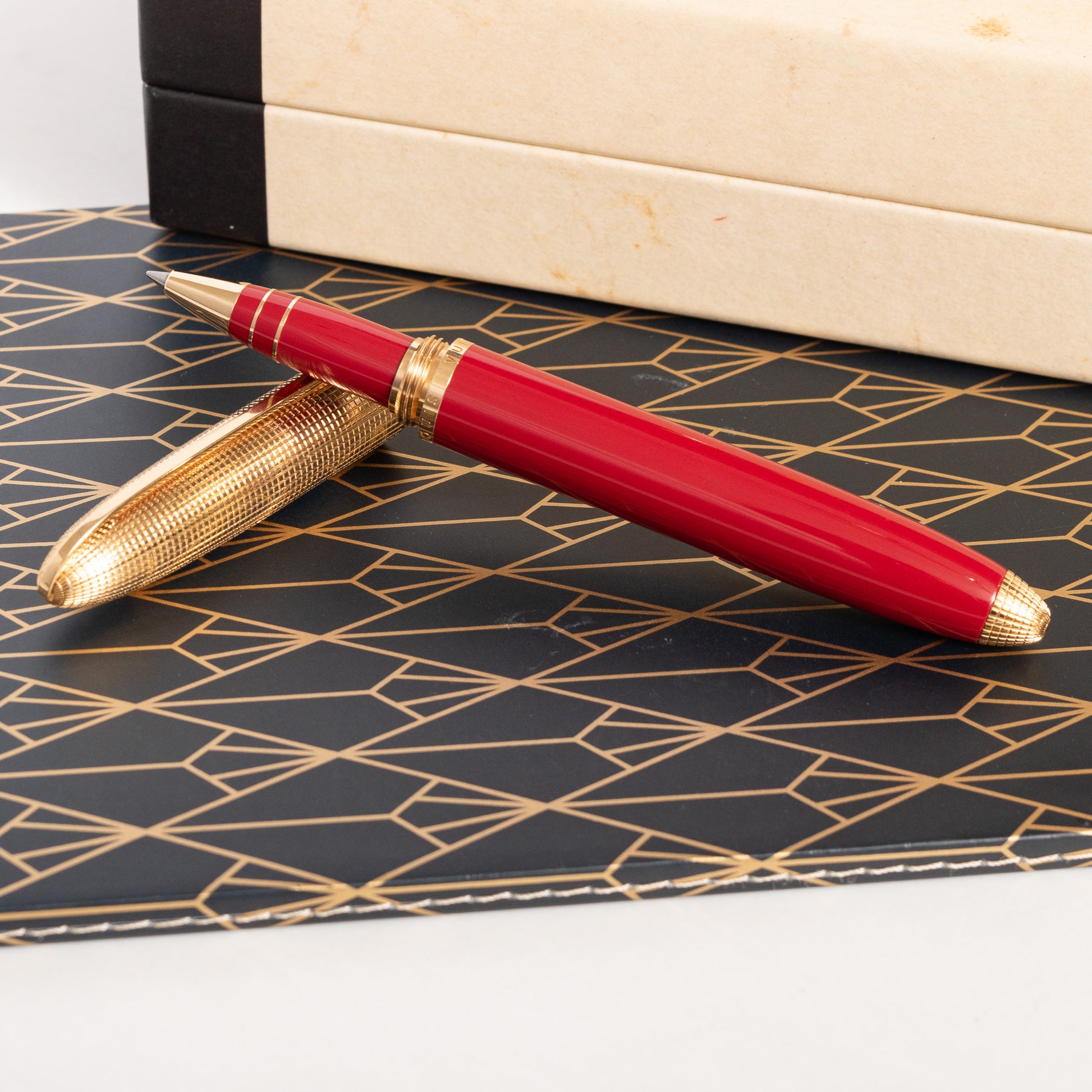 Louis Vuitton, a red leather and gold plated 'Doc Cuir' rollerball pen. -  Bukowskis