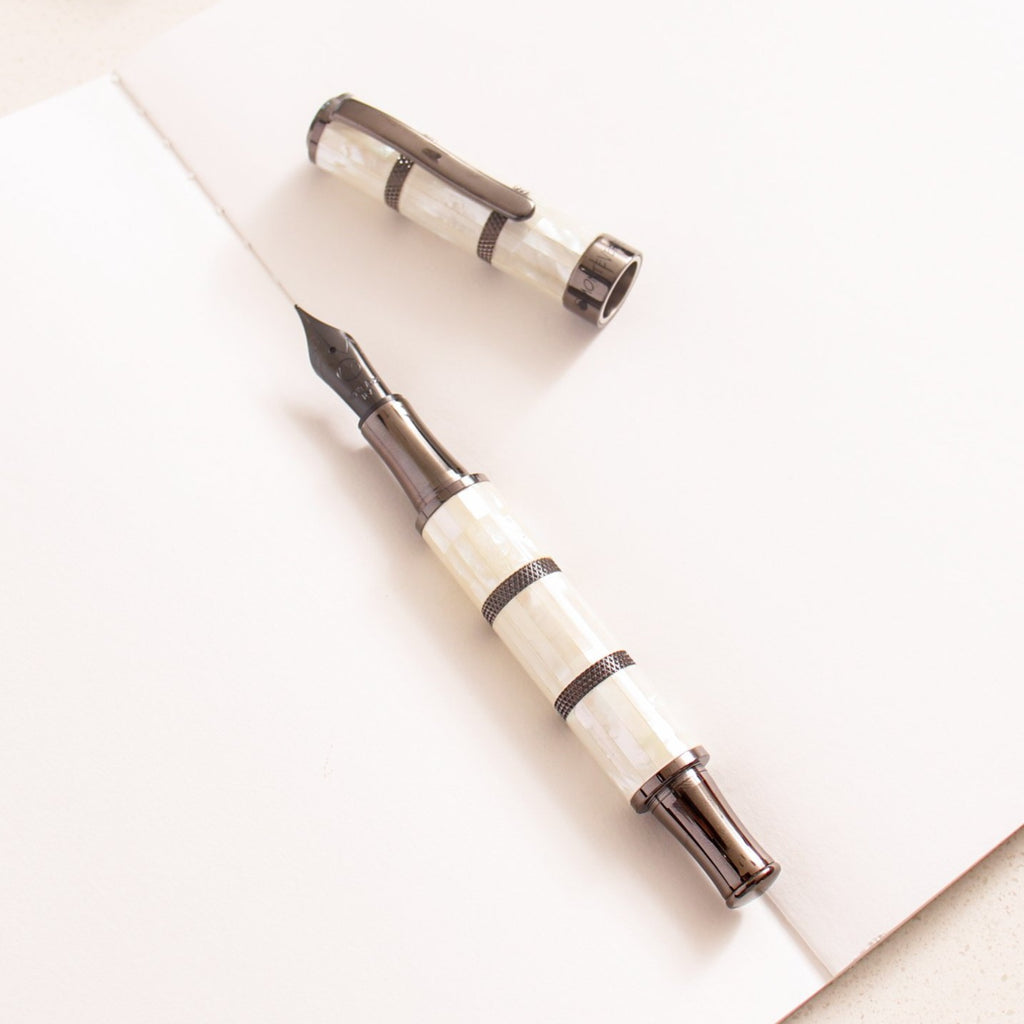 https://www.truphaeinc.com/cdn/shop/products/Monteverde-Regatta-Mother-of-Pearl-Black-Trim-Fountain-Pen_1024x1024.jpg?v=1636065302